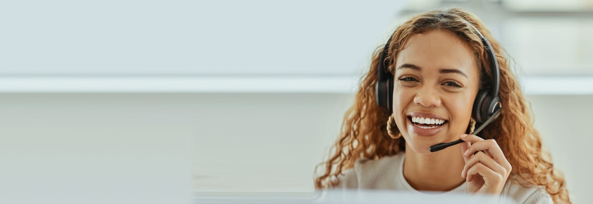 Female receptionist holding headphone mic