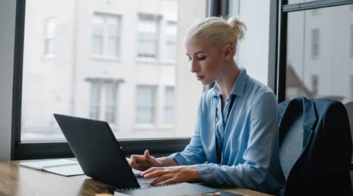 Person writing on a lawyer desk